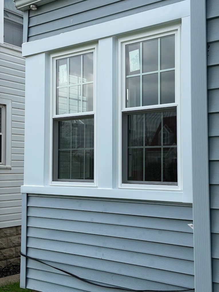 Double-hung replacement windows installed on a Chicago residential property.