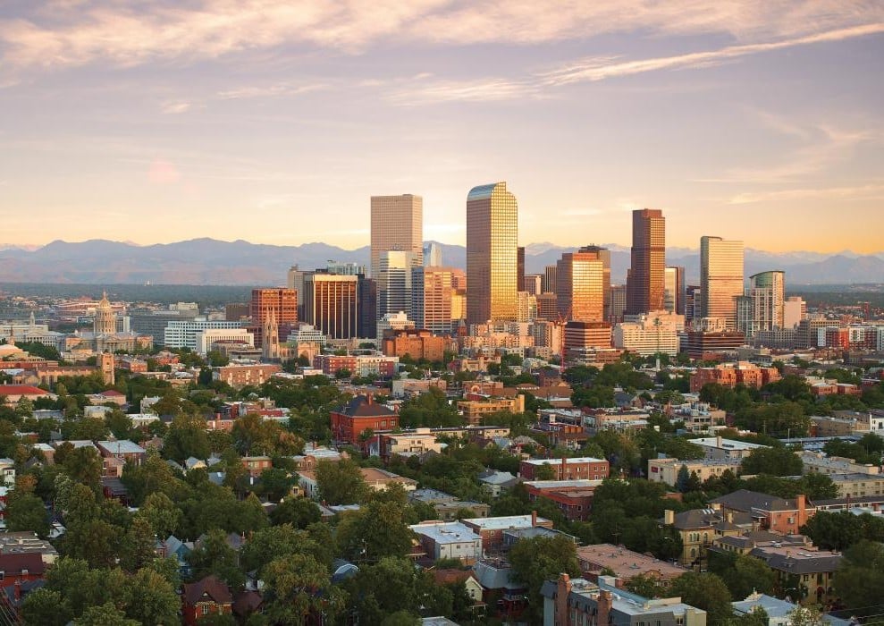 a view of the Denver skyline at dusk
