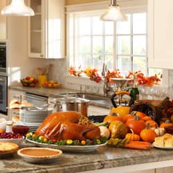 Thanksgiving feast including turkey displayed in a bright kitchen with a huge window
