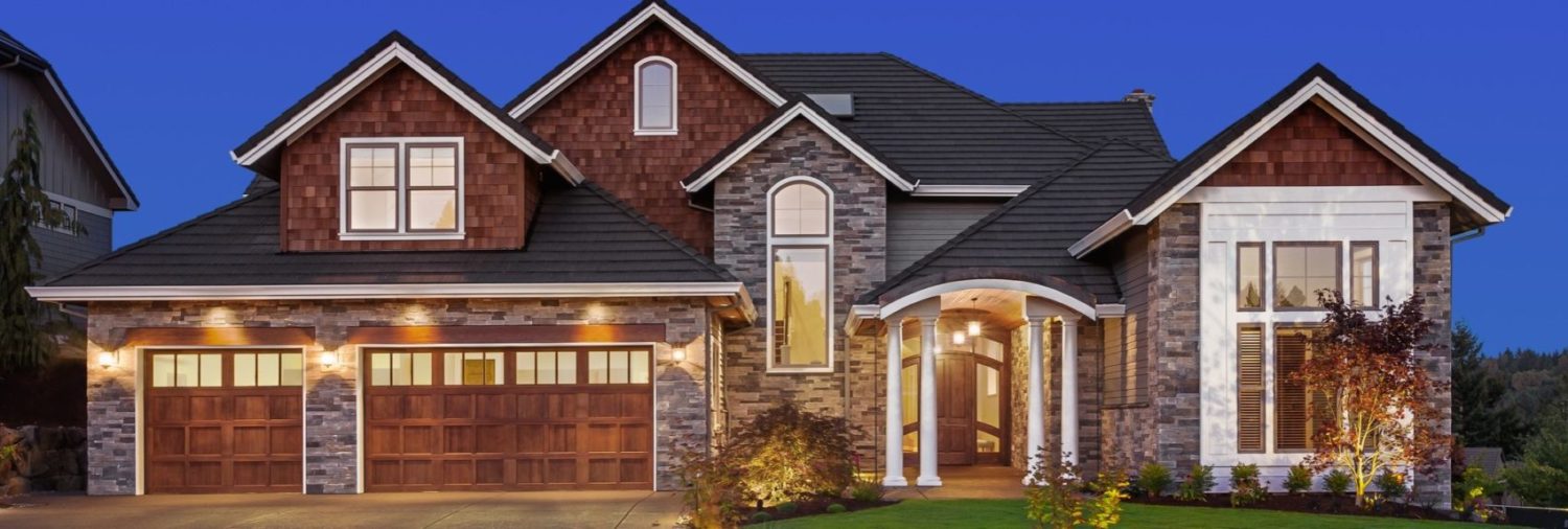 Front elevation of luxury home in evening