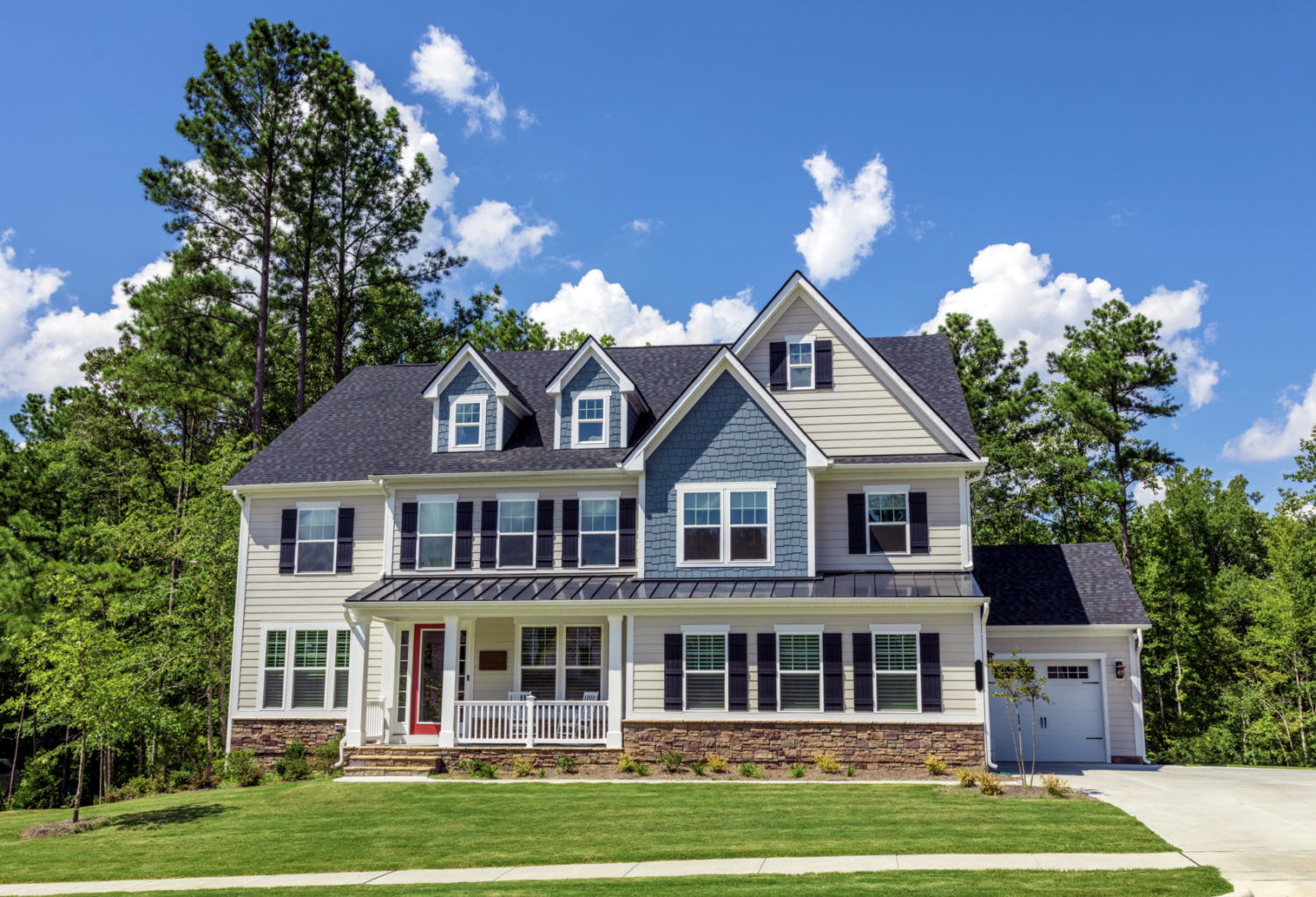 Exterior of single family home with porch and windows with screens and a garage