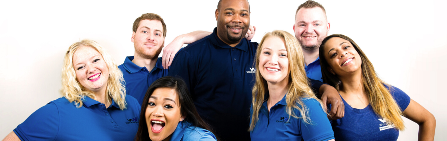 Window Nation Customer Care Employees wearing blue shirts in a group photograph