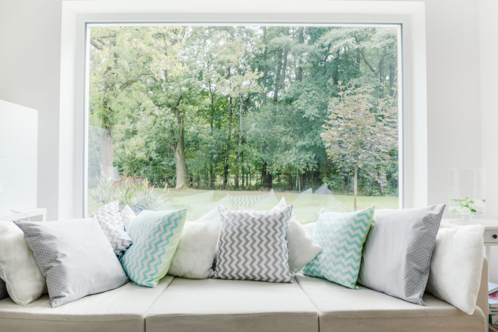 Image of relax area with large sofa and window