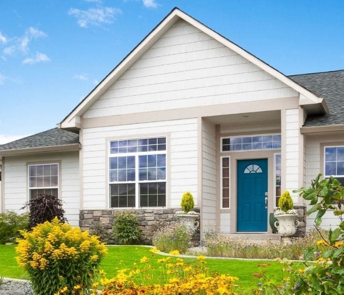 Vinyl Siding on home with blue door