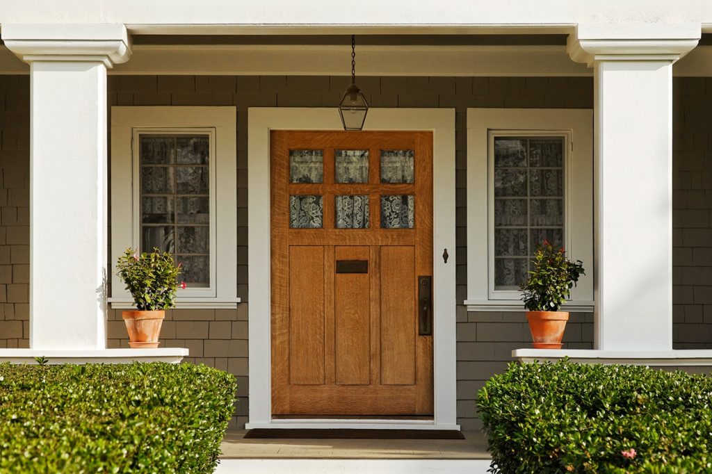 Featured wood entry door.