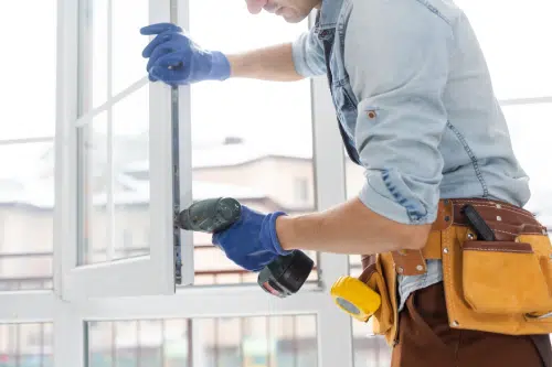 man installing a new window