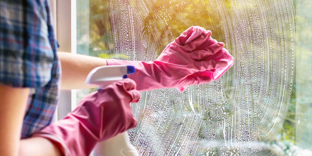 a woman cleaning the windows