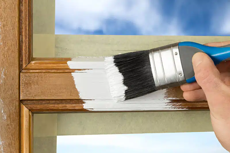 painting a window frame with white color