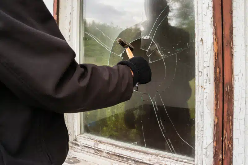 Burglar entering to house through window