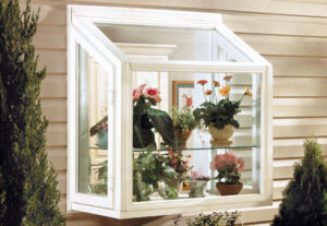 Garden window in a home with plants on it's shelves