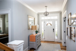 Interior view of a modern home with a front door and a transom window